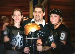 Coach Joel Samuels with Co&ndash;captain Mel Anoma aka Loquacious D(l) and Captain Holly Hunter, after winning the state championship last year. 